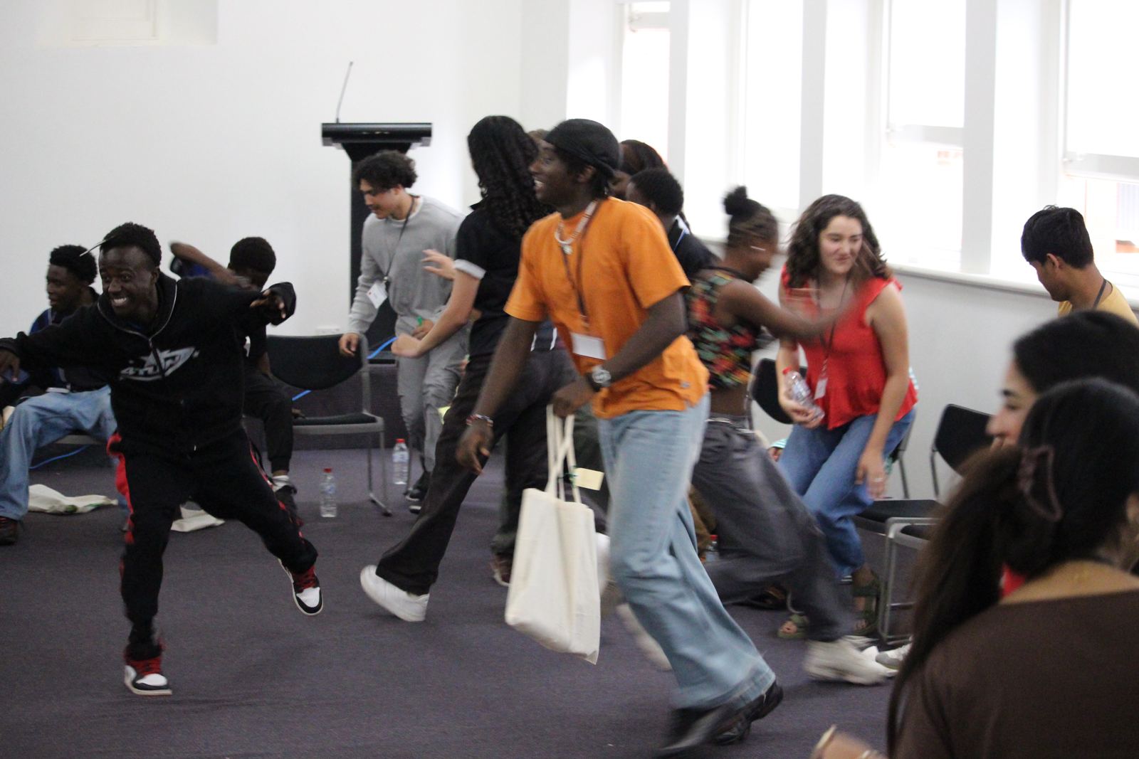 Youth running and playing a game in the hall